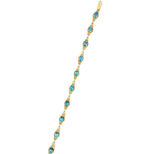 14Y Oval Blue Topaz Bracelet with Beaded Frame Details 7.5"