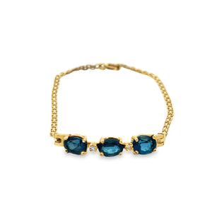 14Y Oval 3 Stone Blue Topaz and Diamond Accent Curved Bar Bracelet 7"